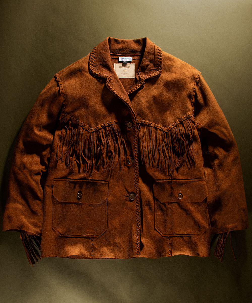 Left Hand Micro Jacket in rich brown suede with fringe detailing, button front and flap pockets.