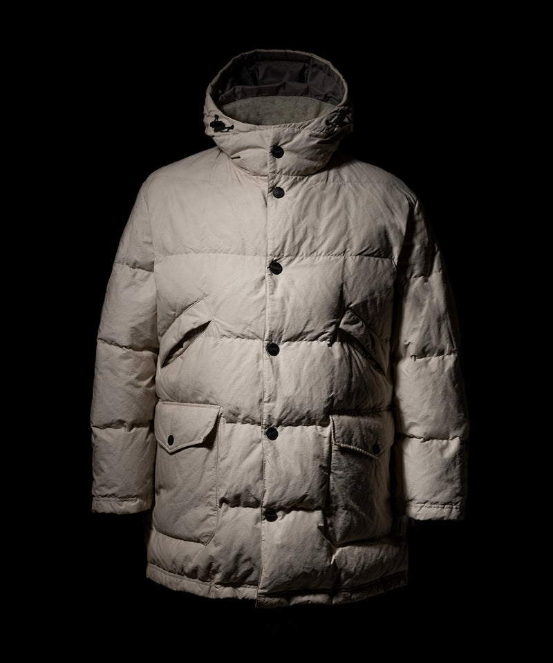 Left Hand 2 Tone Snow Anorak in light beige with quilted design, hood and button closure, displayed against a dark background.