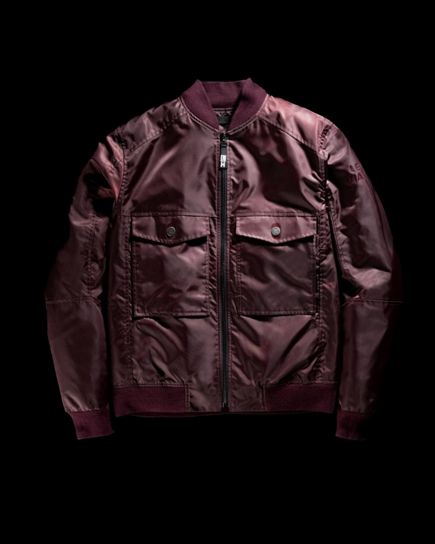 Maroon Left Hand Brembo Bomber jacket on a black background