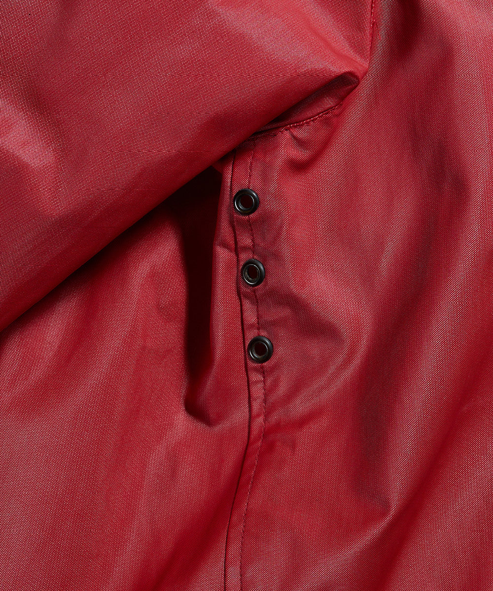 Close-up of a red Left Hand Thermojoint Ladies Harrington jacket with buttons
